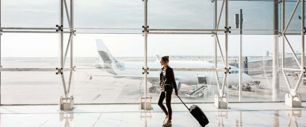 Person carrying luggage at the airport